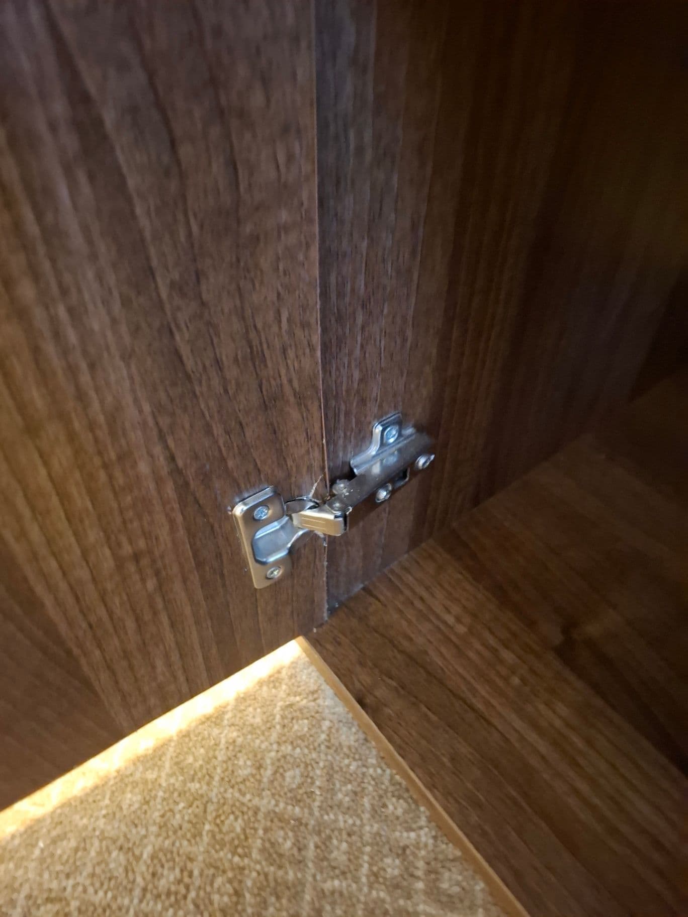 New wardrobe hinge fitted and door realigned